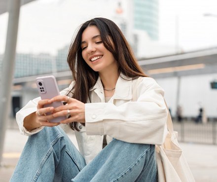 Lady reads something on phone?