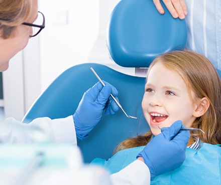 Child smiles at dentist