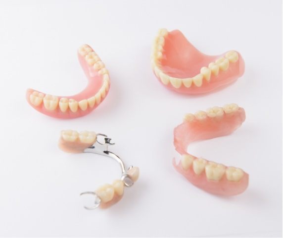 Two full dentures and two partial dentures in Vero Beach Florida