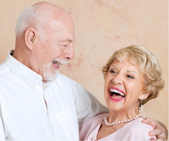 Senior man and woman laughing together