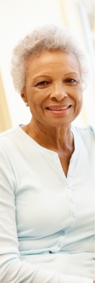Smiling senior woman in white blouse