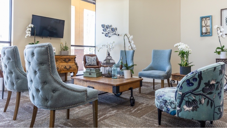 Soft blue armchairs in dental office waiting room