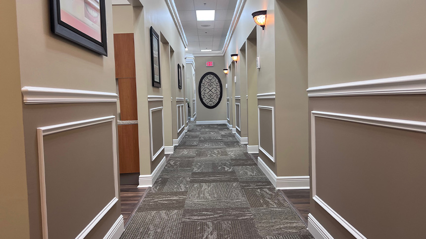 Hallway in dental office leading to dental treatment rooms