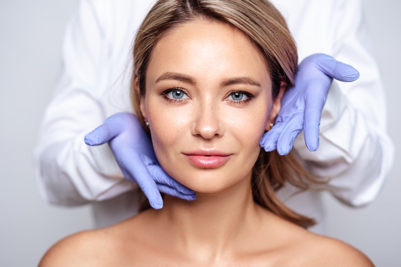 Woman smiling after her dermal filler treatment